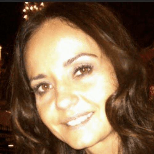 Portrait of Jasmin, a professional stylist at Invidia Salon and Spa, showcasing their expertise and style.