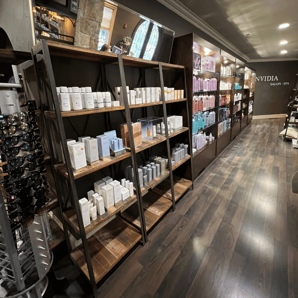 Shelves displaying various hair and spa products in a salon setting.