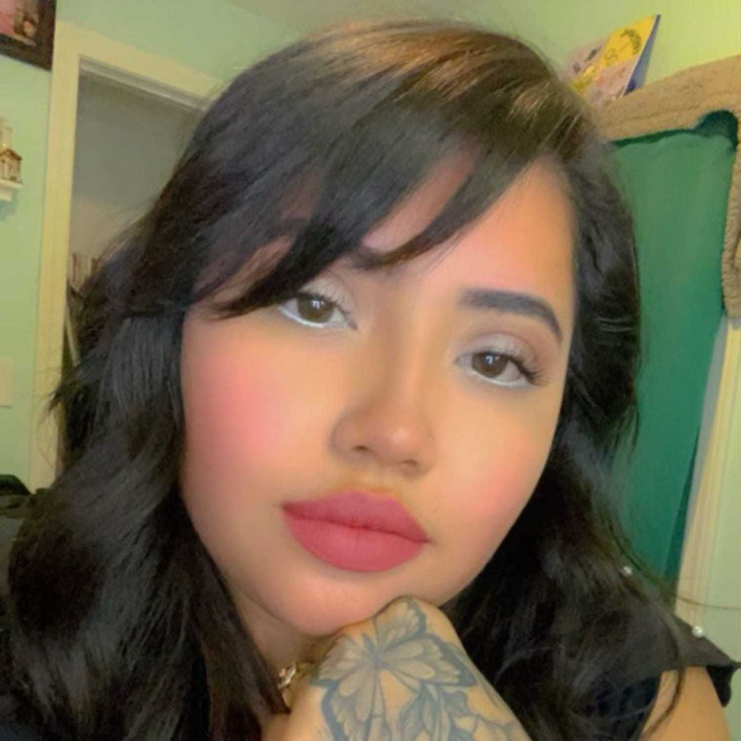 Portrait of Katie Monte, a professional stylist at Invidia Salon and Spa, showcasing their expertise and style.