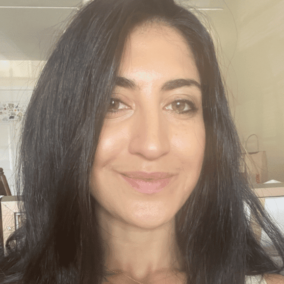 Portrait of Noosha Talebzadeh, a professional stylist at Invidia Salon and Spa, showcasing their expertise and style.