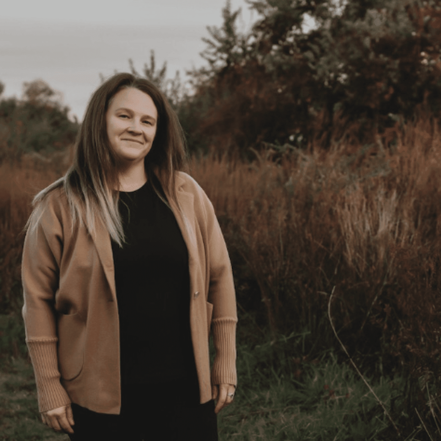 Portrait of Tammy Frates, a professional stylist at Invidia Salon and Spa, showcasing their expertise and style.