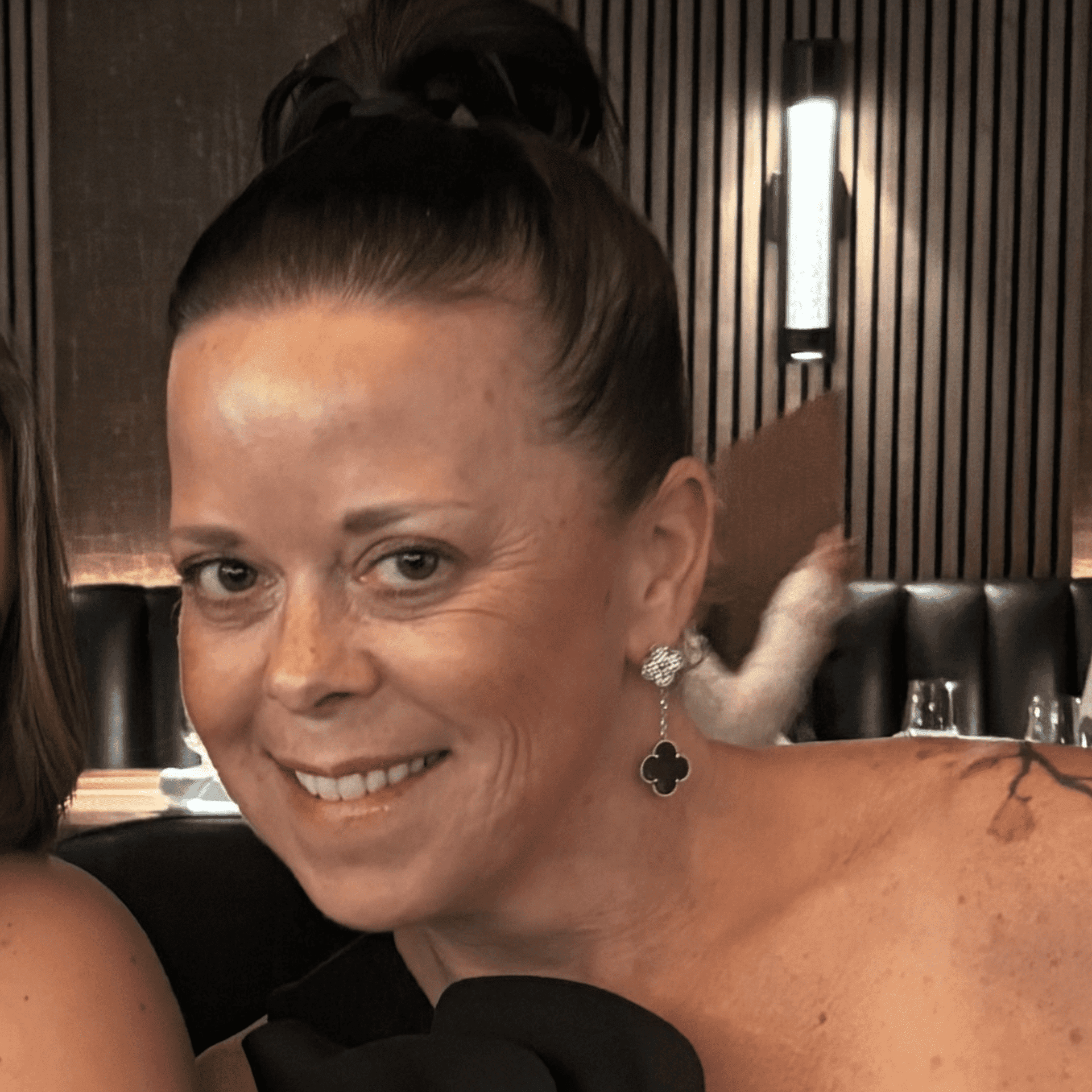 Portrait of Rachel, a professional stylist at Invidia Salon and Spa, showcasing their expertise and style.