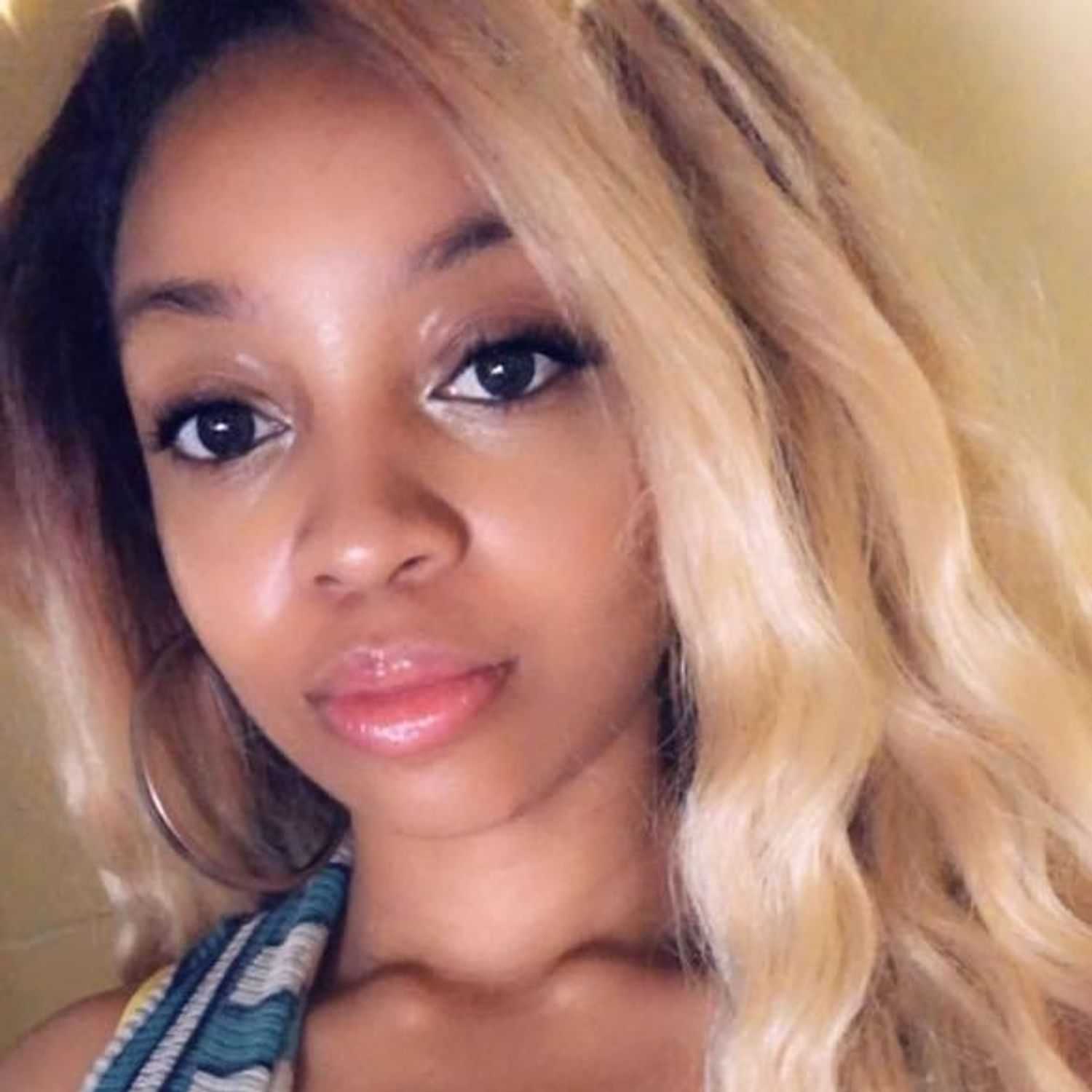 Portrait of Shanice Wilson, a professional stylist at Invidia Salon and Spa, showcasing their expertise and style.