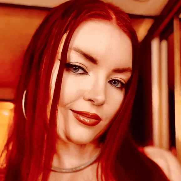 Portrait of Kat, a professional stylist at Invidia Salon and Spa, showcasing their expertise and style.