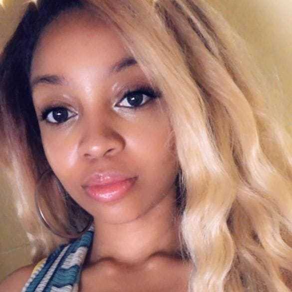 Portrait of Shanice Wilson, a professional stylist at Invidia Salon and Spa, showcasing their expertise and style.