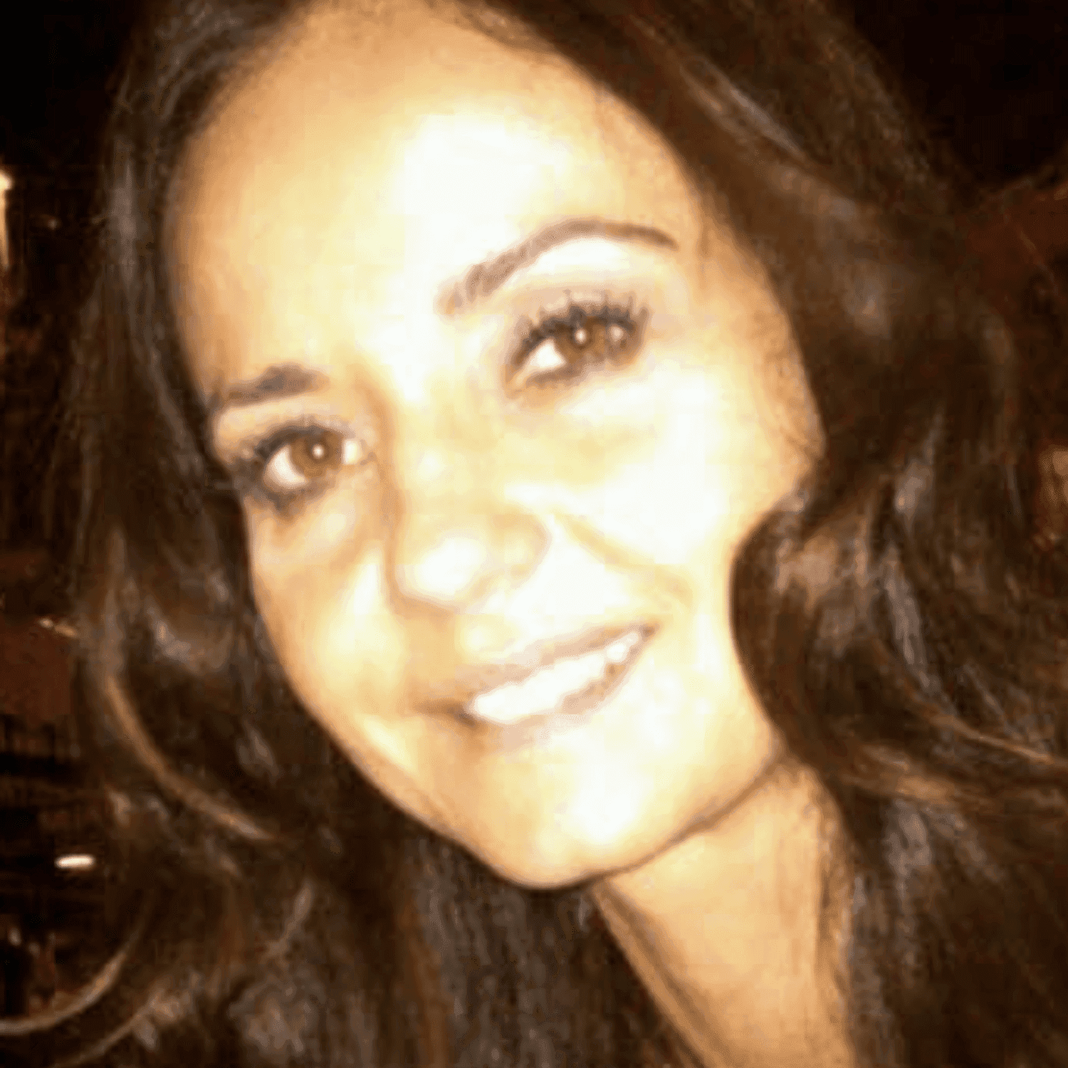 Portrait of Jasmin, a professional stylist at Invidia Salon and Spa, showcasing their expertise and style.