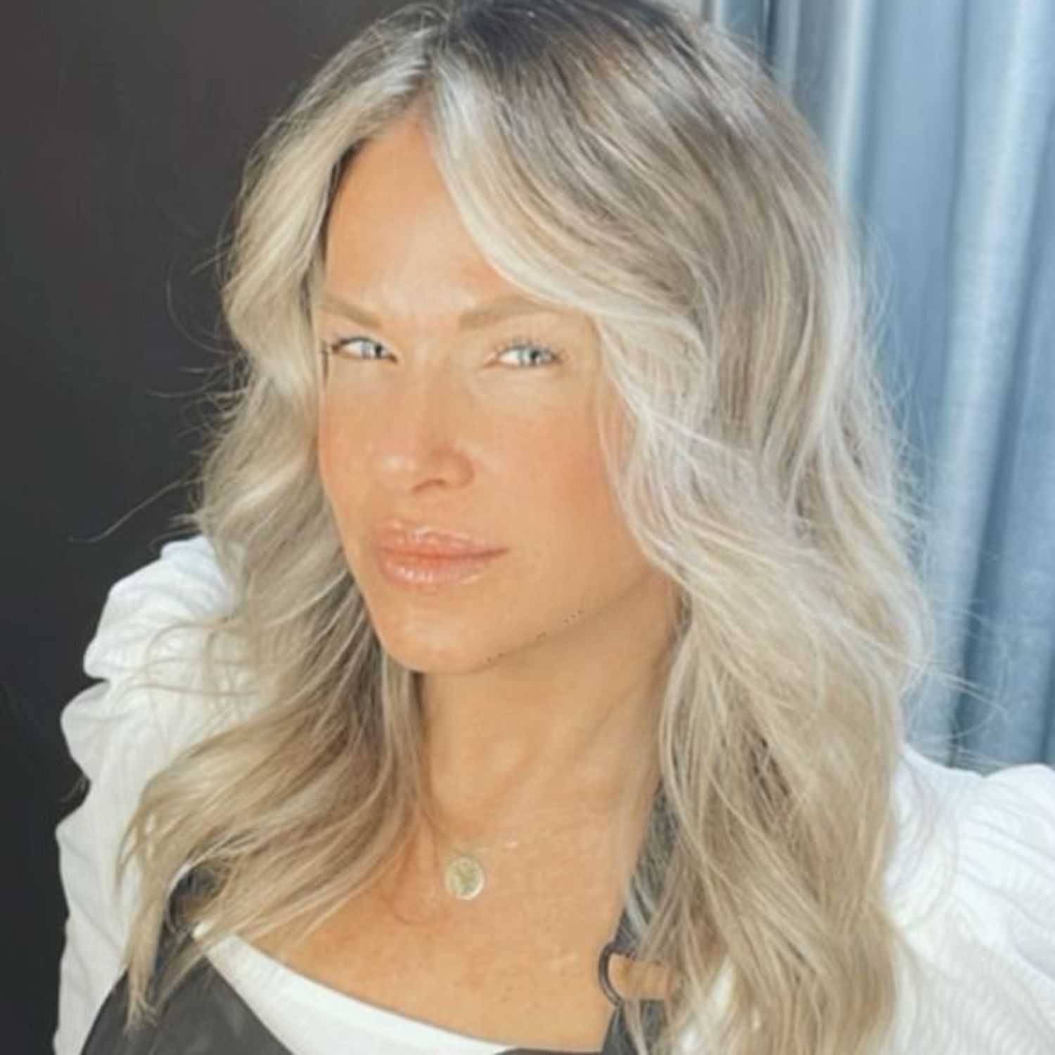 Portrait of Erin Trefry, a professional stylist at Invidia Salon and Spa, showcasing their expertise and style.