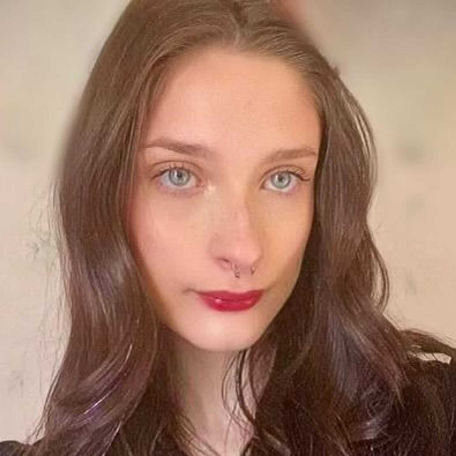 Portrait of Sarah Draleau, a professional stylist at Invidia Salon and Spa, showcasing their expertise and style.