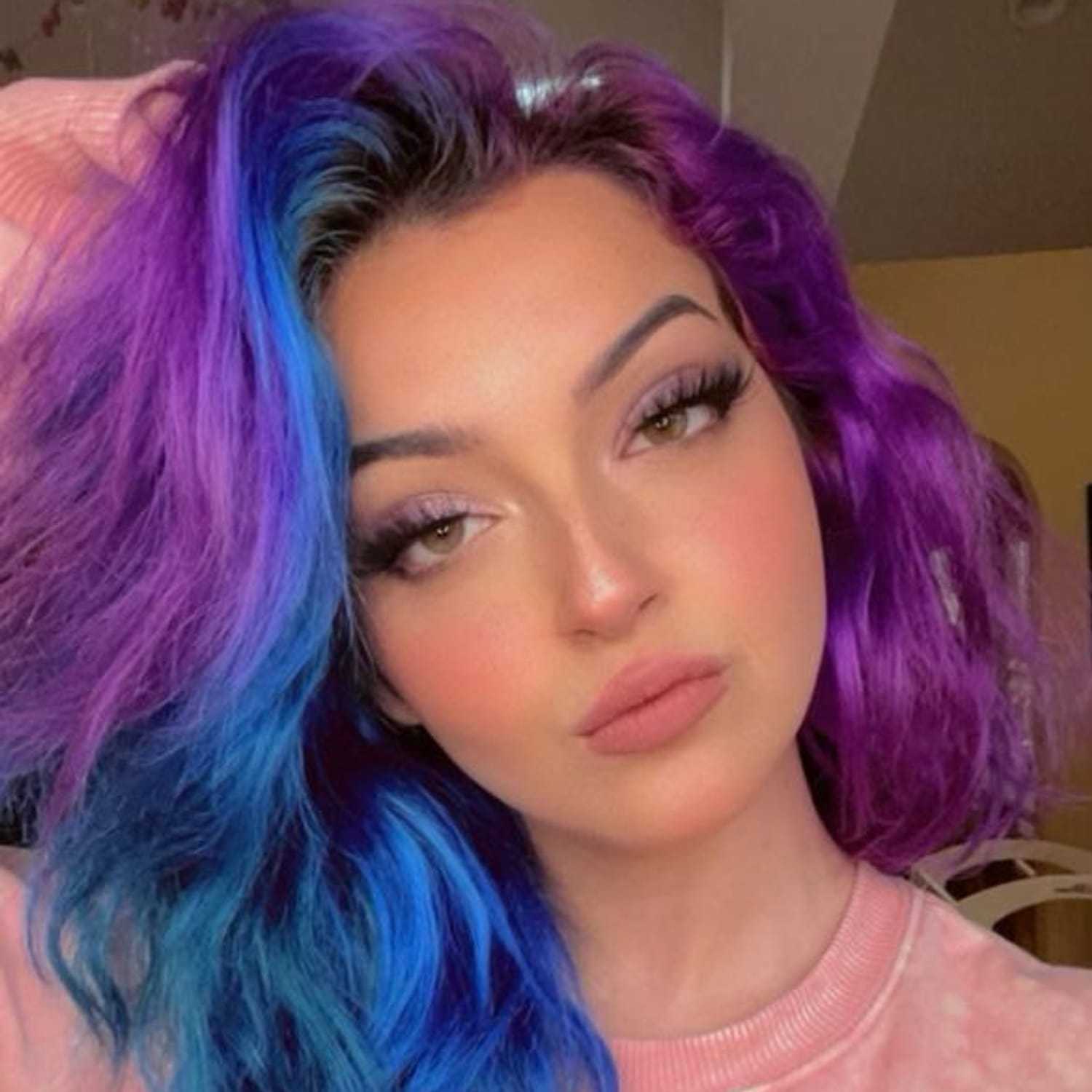 Portrait of Jackie Vannie, a professional stylist at Invidia Salon and Spa, showcasing their expertise and style.