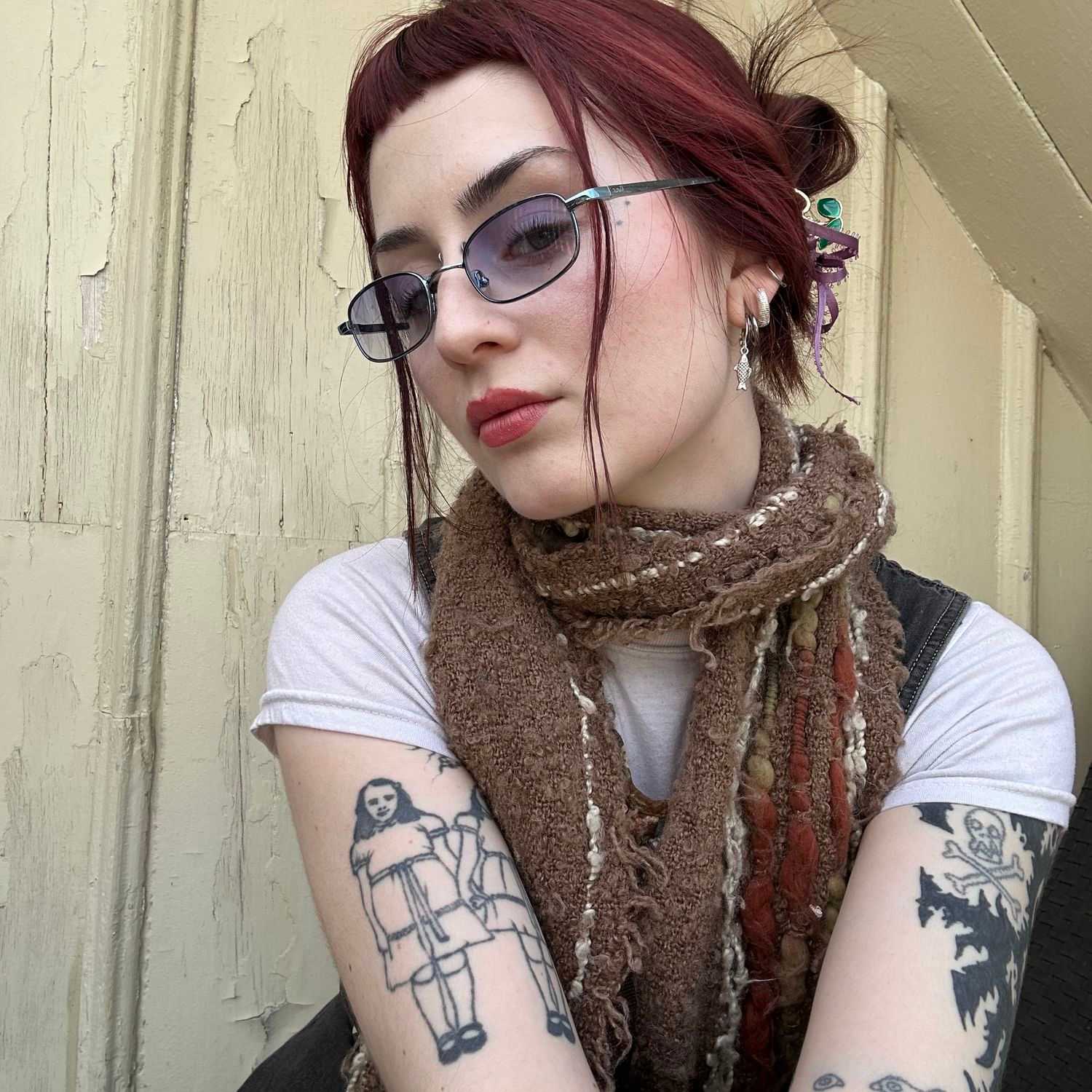 Portrait of Kate White, a professional stylist at Invidia Salon and Spa, showcasing their expertise and style.