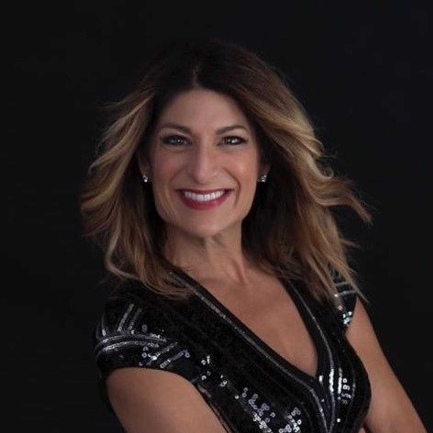 Portrait of Lucia Luciano, a professional stylist at Invidia Salon and Spa, showcasing their expertise and style.